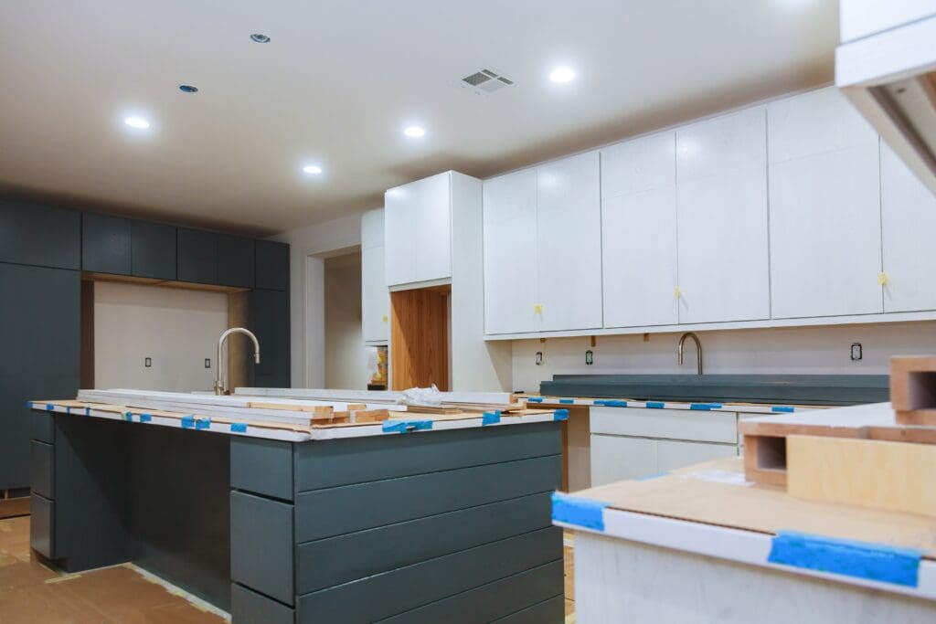 Builders K crew installing new kitchen cabinetry