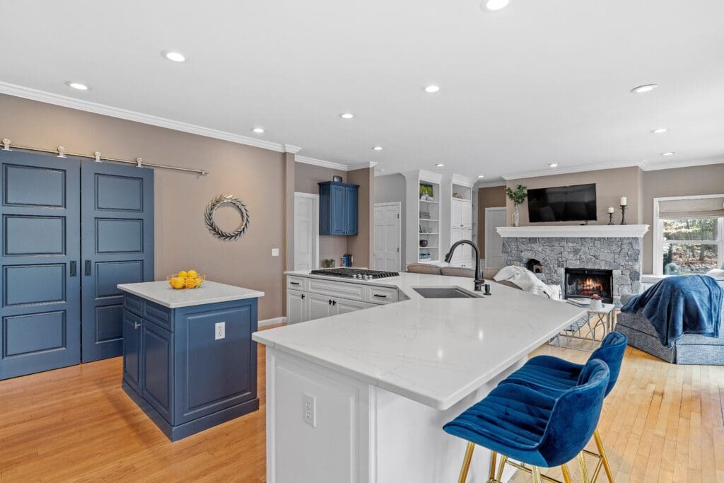 Open-concept kitchen and living room remodel by Builders K