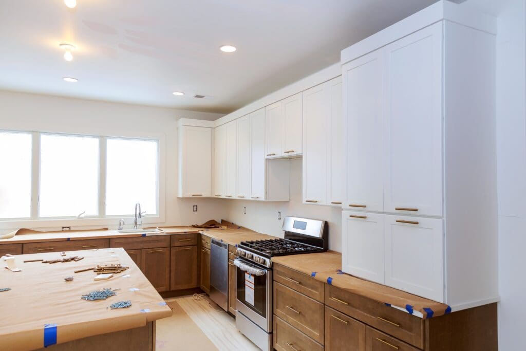 Kitchen mid-remodel with fresh drywall